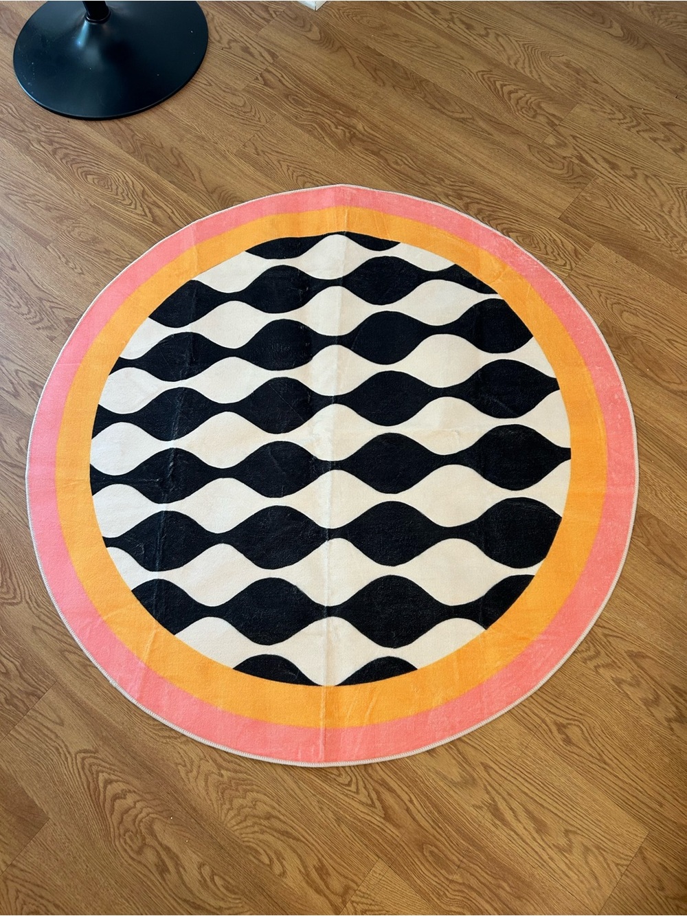 Round Graphic Wave Rug in Black, Cream, Pink & Orange
